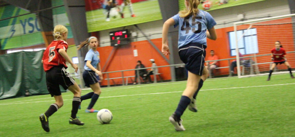 indoor-play Photo of kids playing soccer
